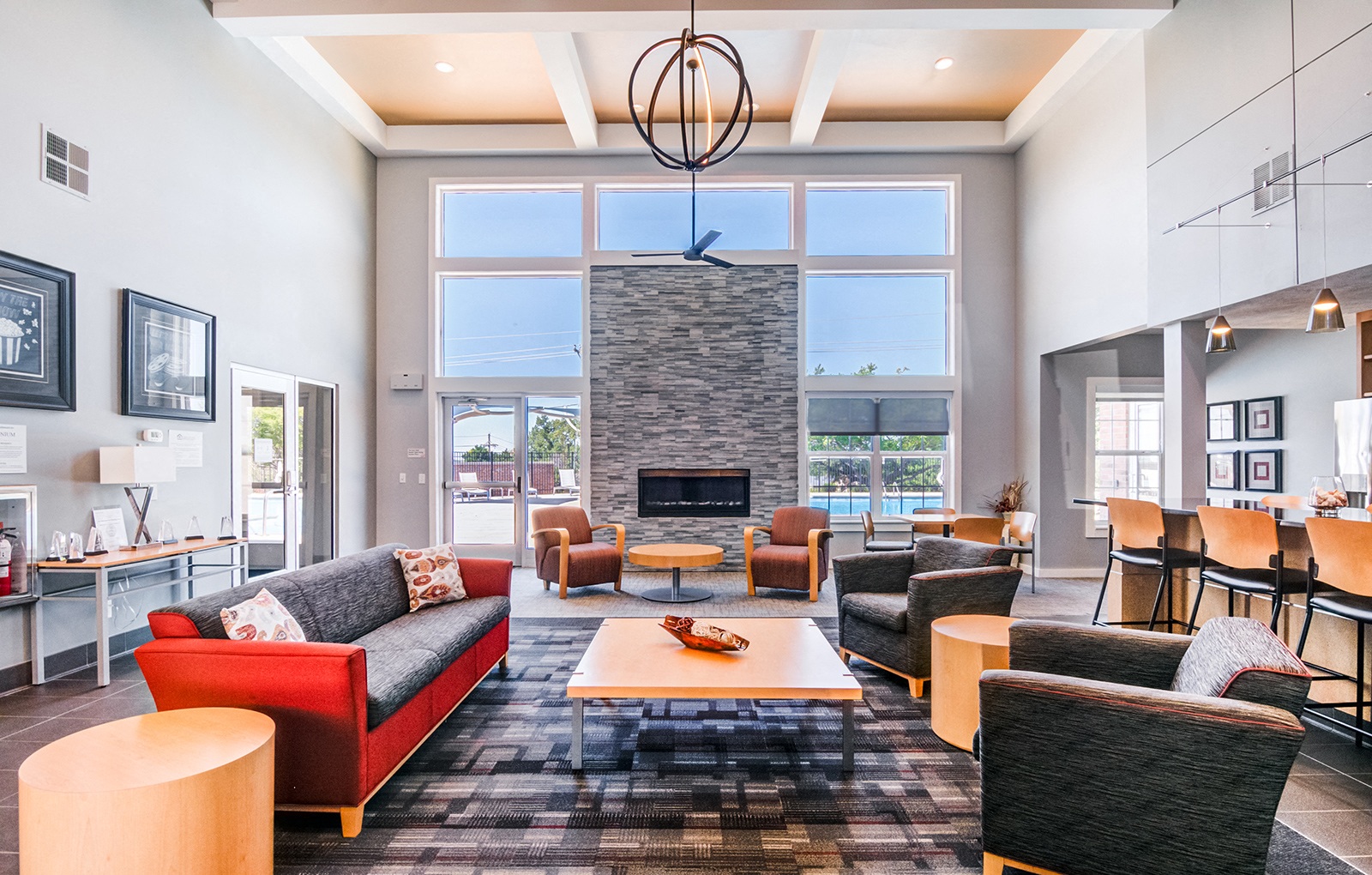 a living room with couches and chairs and a fireplace